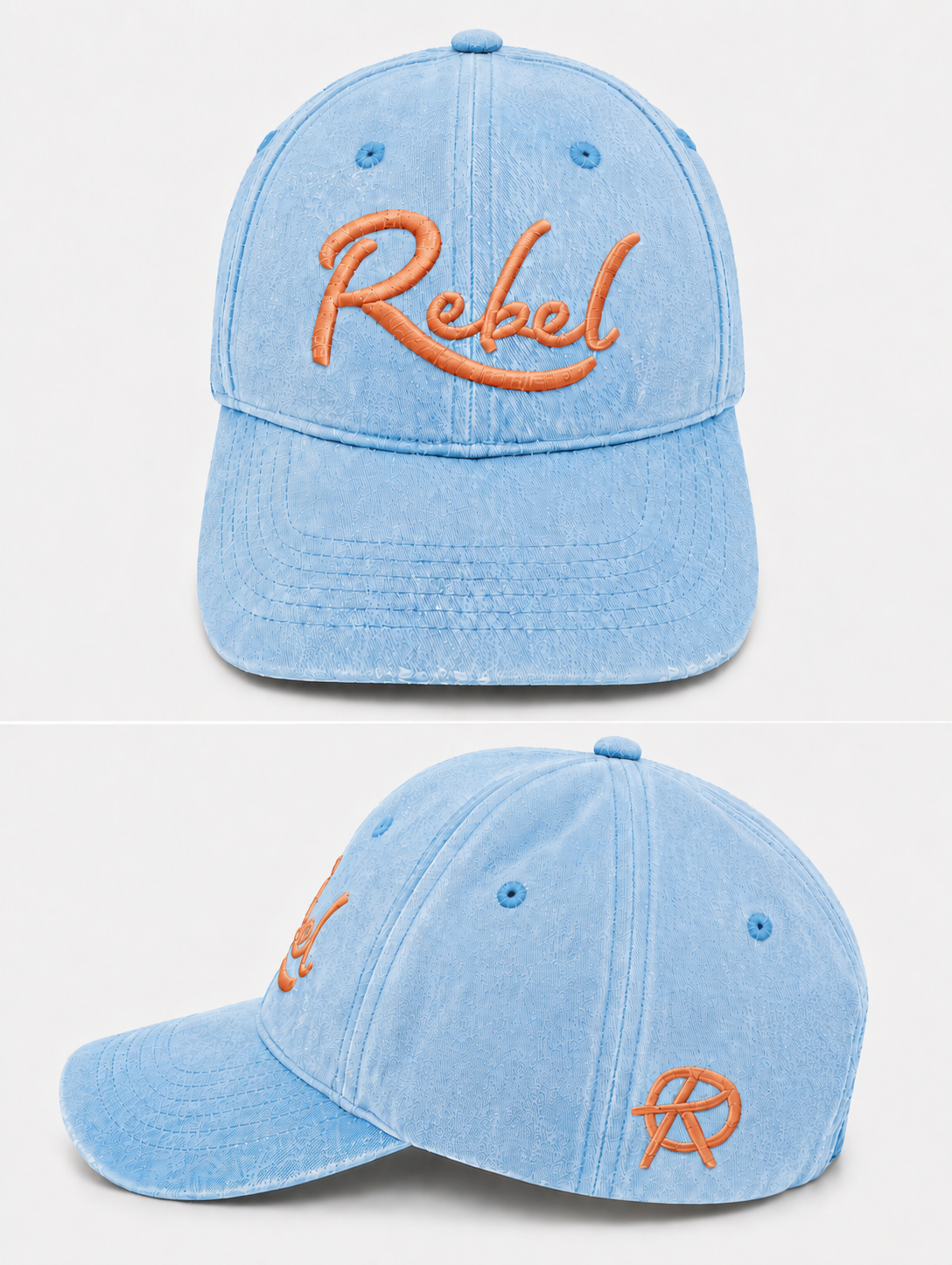 A light blue washed cotton baseball cap shown from the front and side angles against a light gray background. The front features the word 'Rebel' embroidered in orange script, and the side displays a small Anarchy inspired embroidered 'R' logo.