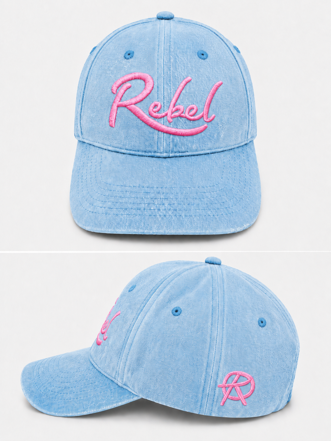 A light blue washed cotton baseball cap shown from the front and side angles against a light gray background. The front features the word 'Rebel' embroidered in pink script, and the side displays a small Anarchy inspired embroidered 'R' logo.